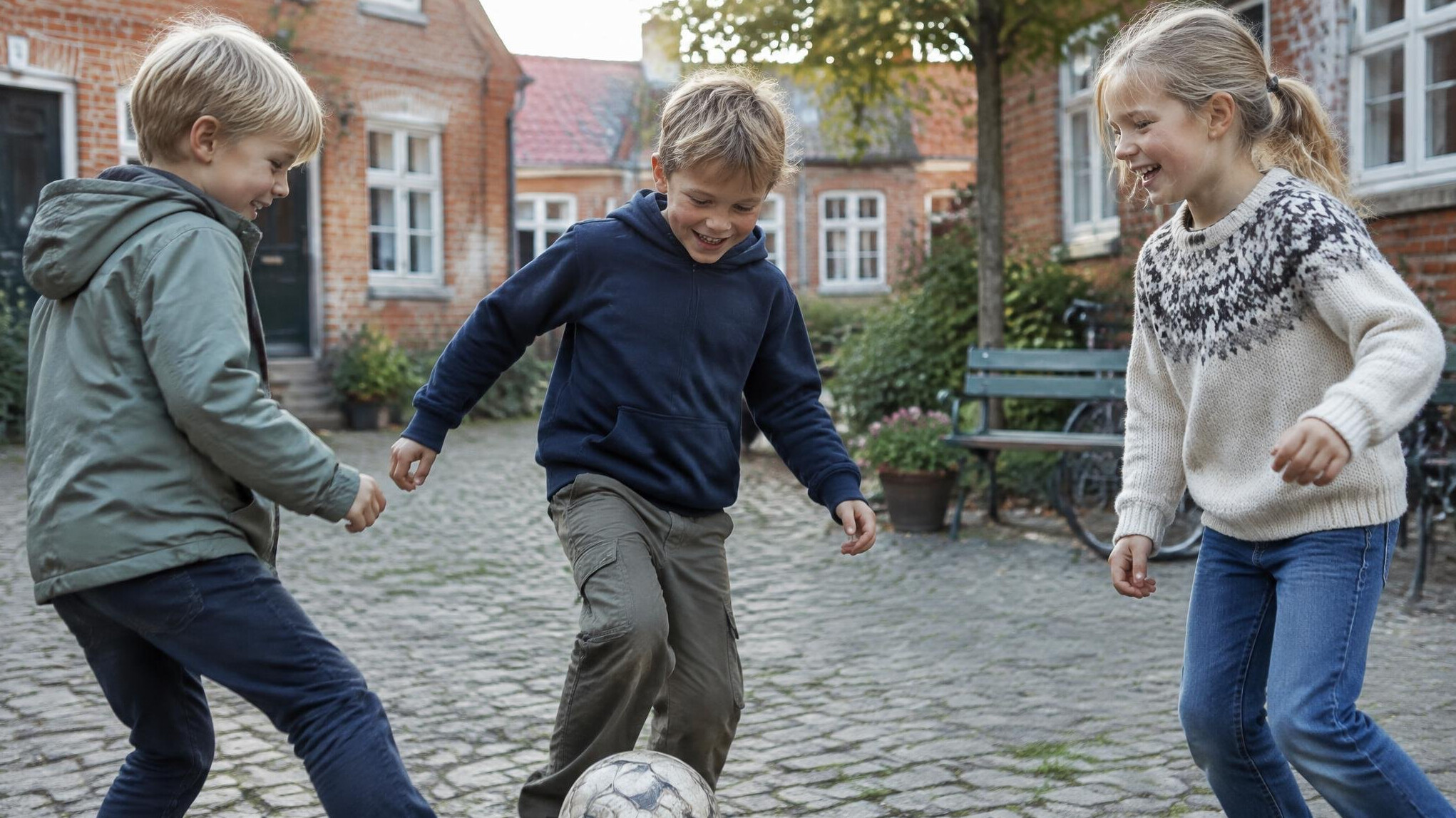 Danish ethnic children playing outside in a small town courtyard